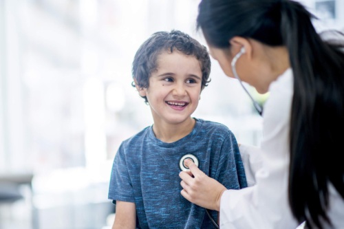 Young patient checked by doctor