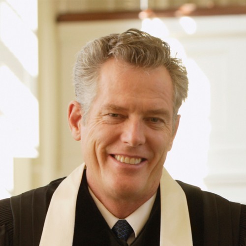 Portrait of smiling pastor wearing religious garb